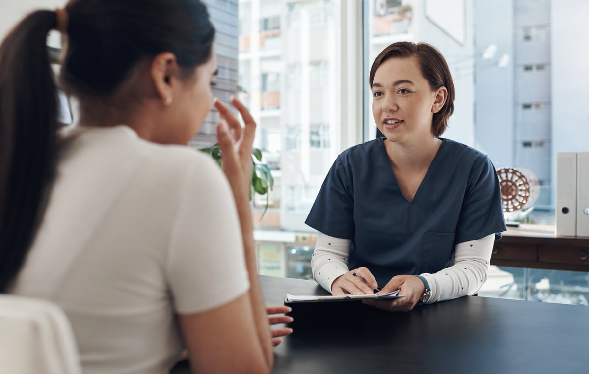 A patient being examined and consulted by a clinician